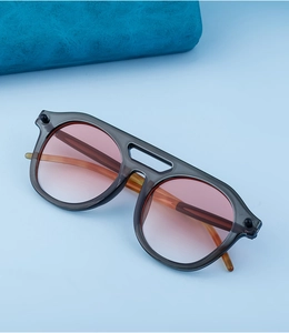 Detail view of steampunk oversized sunglasses with gradient lenses and double bridge design