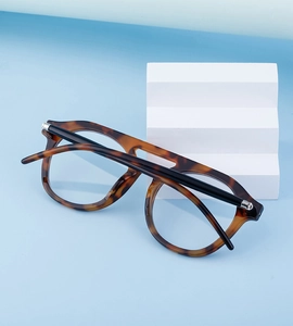 Detail of steampunk tortoise shell sunglasses with double bridge on a geometric display
