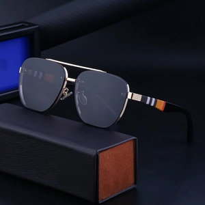 Frameless square pilot sunglasses with gold metal frame and iconic striped temples