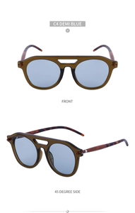 Steampunk sunglasses with demi green frames, blue lenses, and hollow double-bridge detail