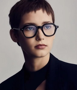 Close-up of retro square frame sunglasses worn by female model for stylish look