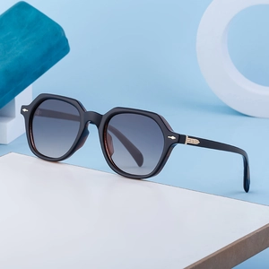 Retro rectangle sunglasses with dark grey frames and gradient lenses on a geometric base