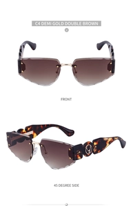 Detail of rimless sunglasses with engraved tortoise temple and golden deer head ornament