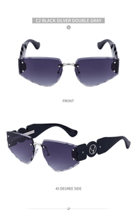 Macro shot of rimless sunglasses with gradient lenses and wide black deer logo temples