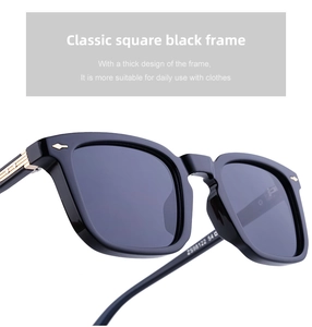 Detailed macro view of square black frames with gold arrow accents and metallic hinges