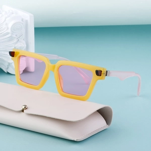 Retro square frame sunglasses with yellow frame and purple lenses on beige case