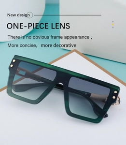 Détail de lunettes de soleil carrées à verre unique avec points dorés et monture verte