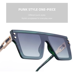 Détail des lunettes punk vertes montrant les branches en métal et le design industriel