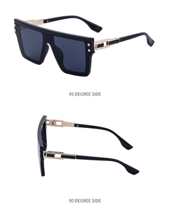 Détail de lunettes de soleil punk avec branches en métal ajouré doré et monture noire