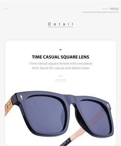 Detail of square sunglasses with thick blue frame and golden metal temples on white base