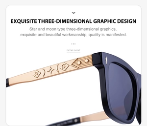 Detail of gold metal temples with star and moon relief graphics on black sunglasses