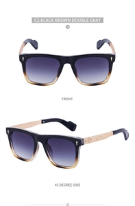 Close-up of champagne gold temples with detailed floral engravings and gradient gray lenses