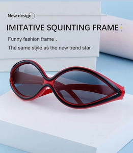 Macro detail of red and black Y2K squinting frame sunglasses on minimalist display