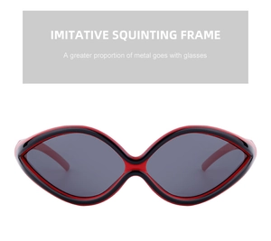 Close-up of Y2K cycling sunglasses featuring a unique red and black cat-eye metal frame