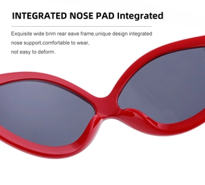 Detail view of red cycling sunglasses featuring integrated nose pads for comfortable wear