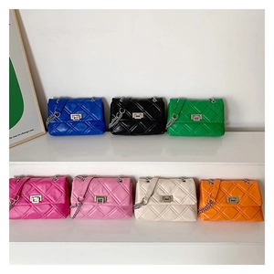 Detailed display of seven color variants for quilted crossbody bags with chain straps