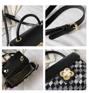 Detail view of tweed patchwork bag handle, metal clover lock, and adjustable strap