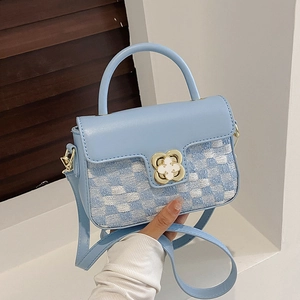 Blue and white plaid woven crossbody bag with gold flower buckle and leather handle