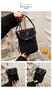 Detail of black lamb wool crossbody bag showing leather horn button and soft plush texture