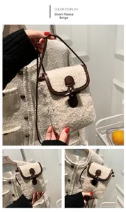 Detail of cream short-fleece bag showing brown leather trim and retro horn buckle clasp