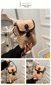 Close-up of khaki plush phone bag with brown leather trim and retro horn buckle detail