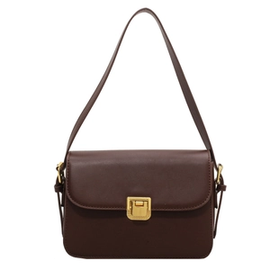 Classic dark brown leather shoulder bag with gold square buckle on white background