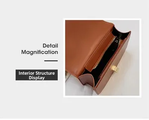 Vue détaillée de l'intérieur du sac en cuir marron avec doublure noire et fermoir doré