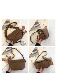Multi-angle views of a brown saddle bag with decorative scarf and dual straps