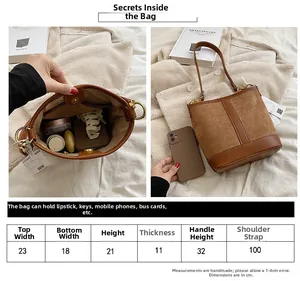 Detail view of large interior capacity of brown patchwork bucket bag with size comparison