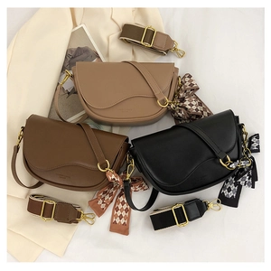 Saddle bags with bow scarf decor, thin straps, and wide jacquard ribbons in three colors