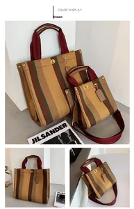 Detailed set of multi-color striped canvas tote bags with leather trim and metal lock