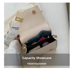 Internal view of the white leather crossbody bag showing ample storage capacity