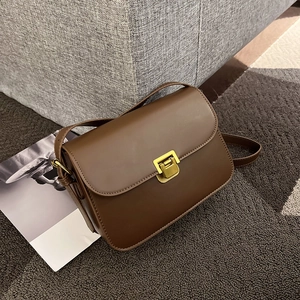Vintage dark brown matte leather shoulder bag with elegant golden square metal clasp
