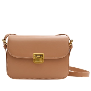 Classic vintage brown leather shoulder bag with gold metal clasp on white background