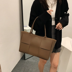 Brown woven leather tote bag for women with spacious design for daily commuting