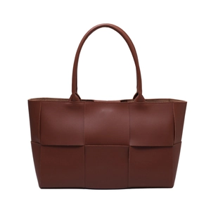 Caramel woven leather tote bag with checkerboard square weave design and long handles