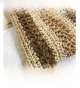 Close-up of dual-tone hand-woven texture on the large capacity straw tote bag