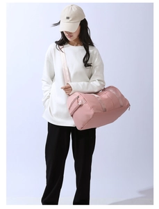Pink multipurpose fitness bag with adjustable shoulder straps and reinforced handles