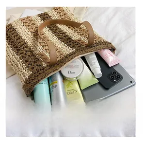 Top-down view of large capacity striped woven tote bag interior with tablet and gadgets
