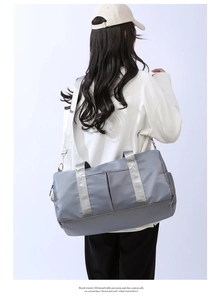 Rear view of grey waterproof nylon travel bag with shoulder strap and large capacity