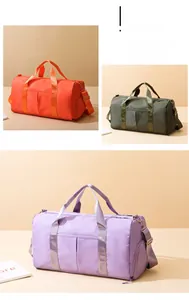 Close-up of waterproof nylon sports bags in orange, green, and purple colors