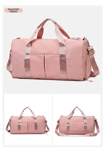 Detail view of pink large capacity travel bag with dry wet separation and straps