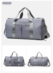 Macro view of a grey waterproof fitness bag with shoe compartment and adjustable strap