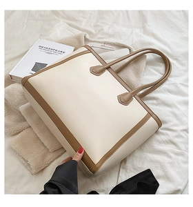 Large capacity tote bag with beige and dark brown contrast stitching on white fabric