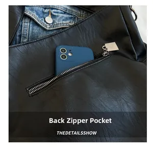 Détail du sac en cuir noir montrant la poche arrière zippée pour ranger un smartphone