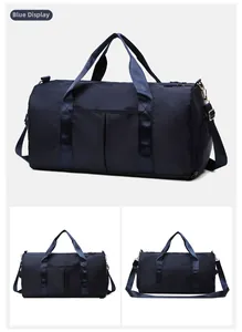 Detail view of large navy blue travel bag with waterproof nylon texture and shoulder strap