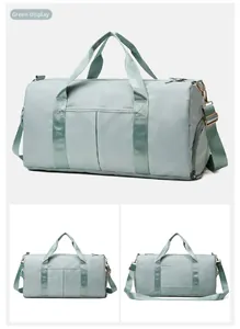 Detail view of large mint green travel bag with separate wet and dry compartments