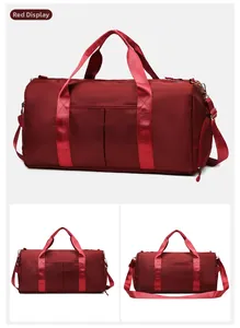 Detail view of large red travel bag with shoe compartment and waterproof fabric