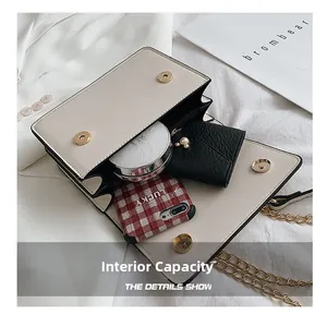 Internal capacity of beige crossbody bag showing dual compartments for phone and wallet