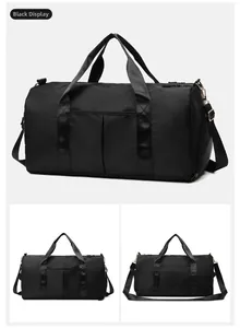 Detail of black sports duffel bag showing woven handles and adjustable golden metal hardware